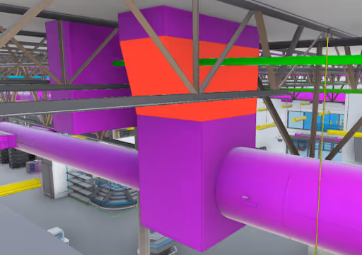 Colorful industrial duct system with purple, red, and green pipes and metal support beams inside a large facility.