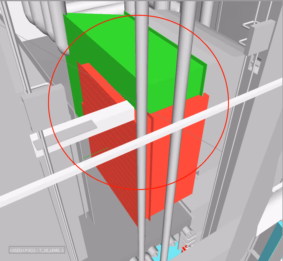 3D model of industrial pipes with a green and red block highlighted by a red circle.