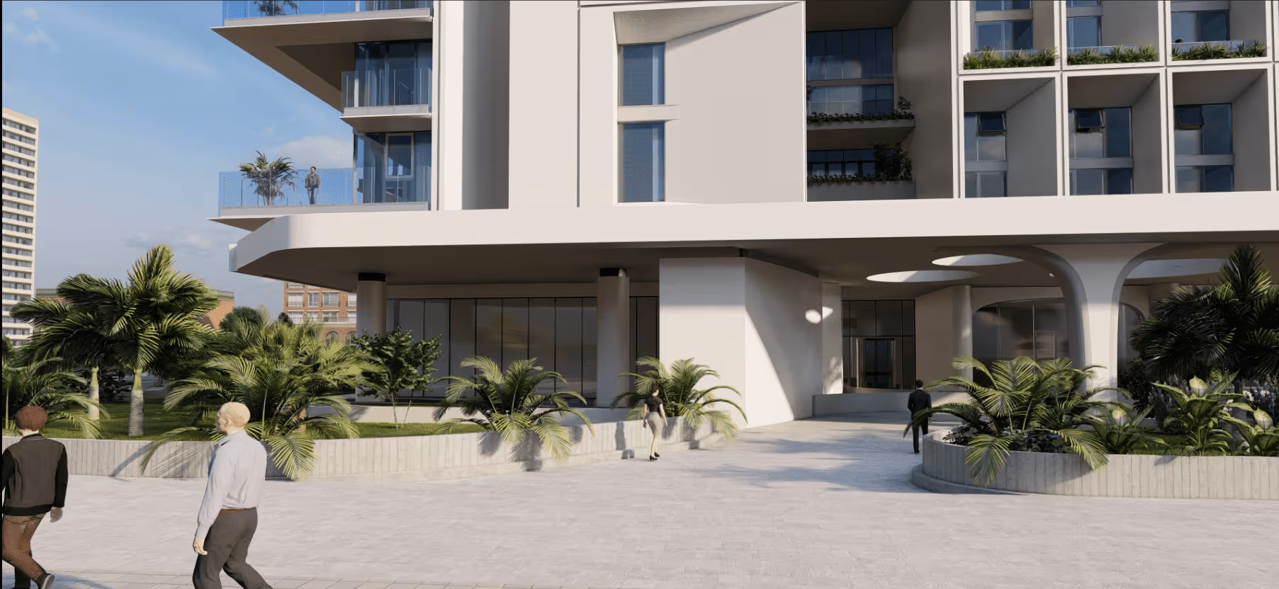 Modern building entrance with large windows, planters, palm trees, and people walking nearby.