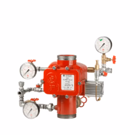 Red fire sprinkler alarm valve with attached pressure gauges and control valves.