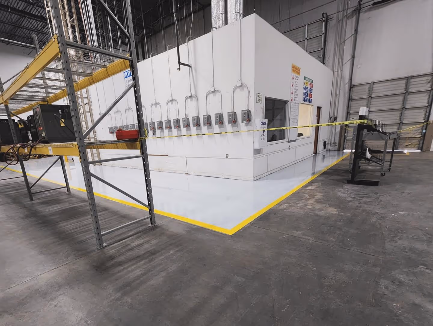 Industrial epoxy floor with safety markings in a Norcross, GA facility