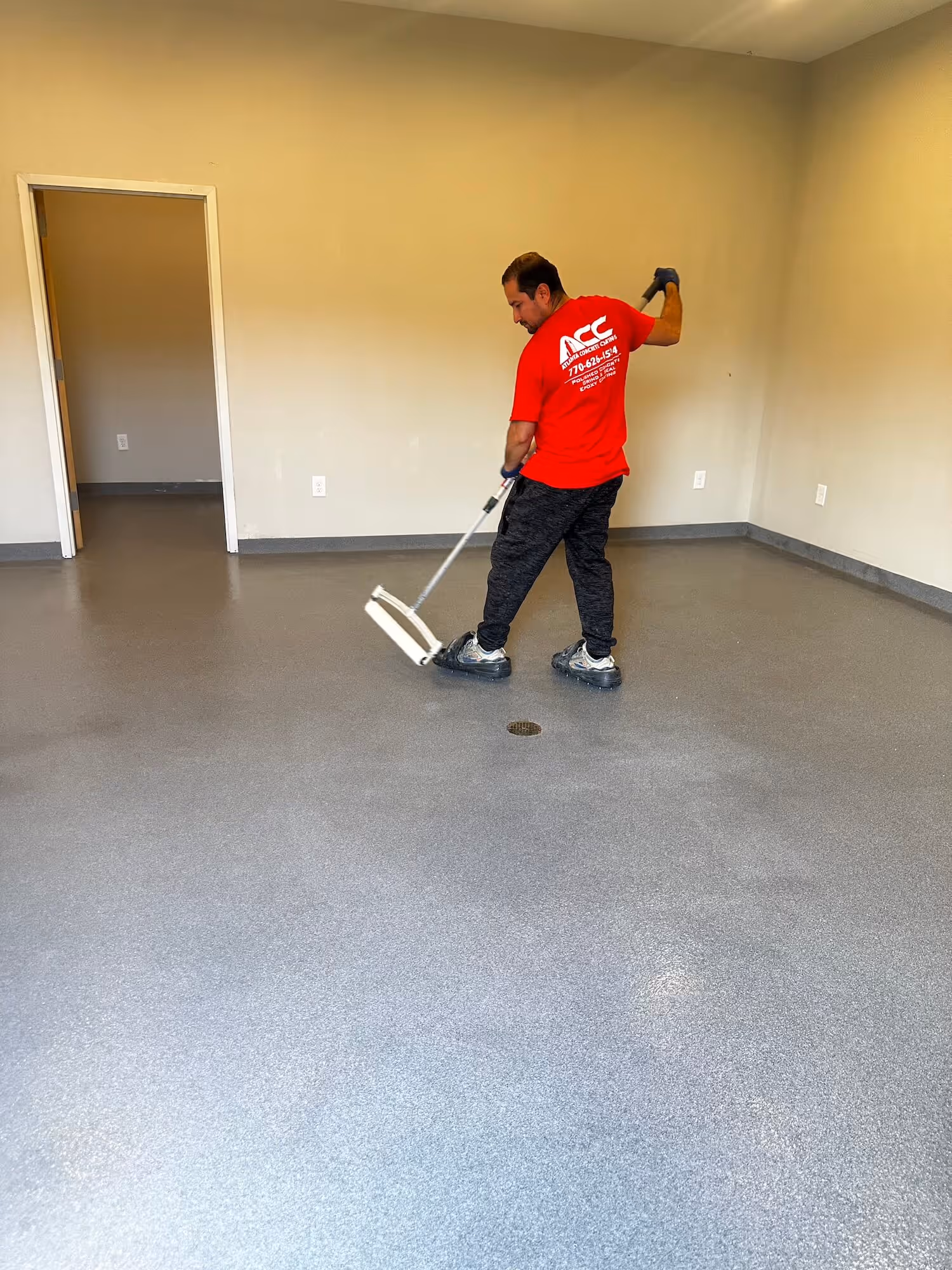 Seamless quartz resin floor installed by ACC Facility Services in an Atlanta commercial kitchen
