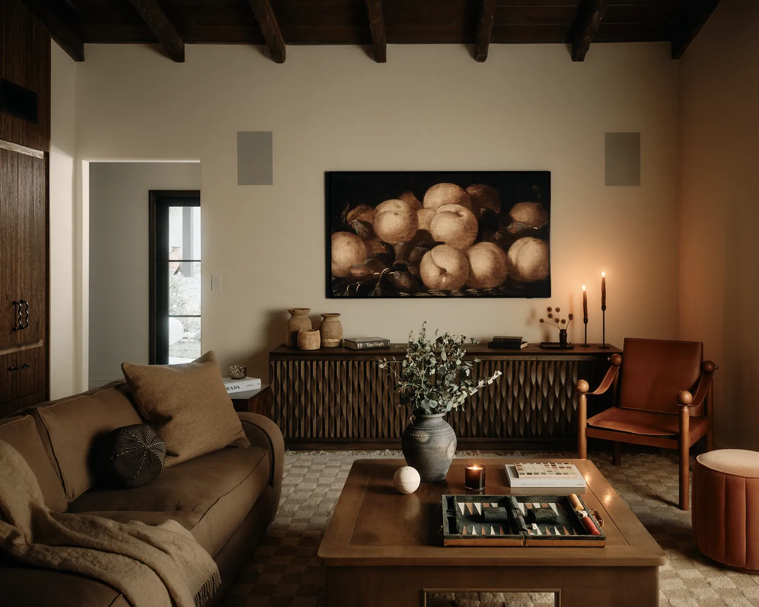 a moody brown and cream living room 