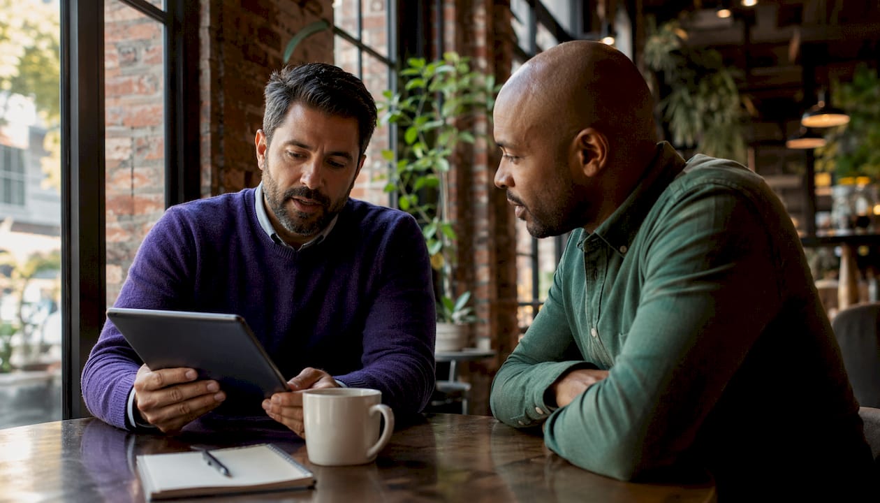 Two men discussing mortgage budgeting benefits