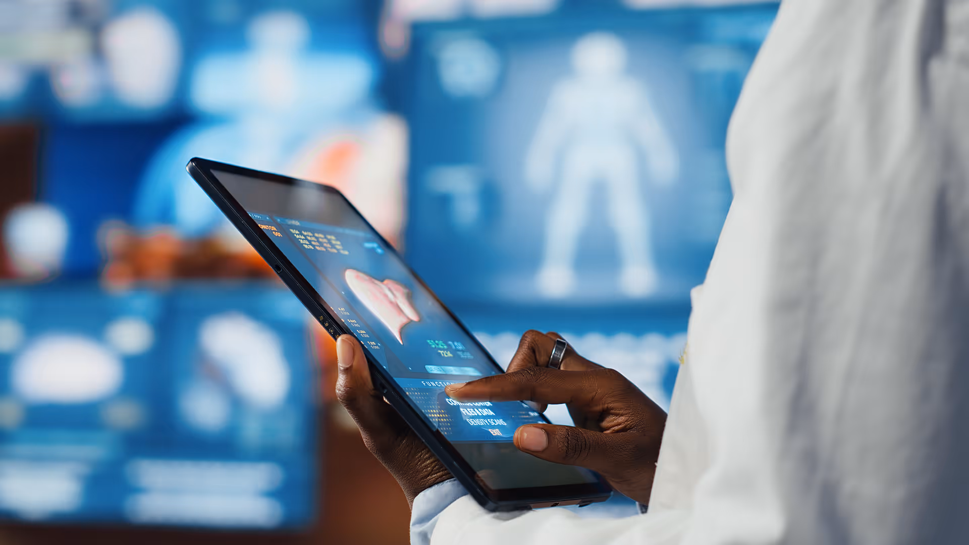 Medical professional holding a tablet displaying a 3D heart scan with blurred medical imagery in the background.