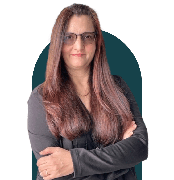Headshot of Rehana Rafiq from waist up smiling in a business casual top.