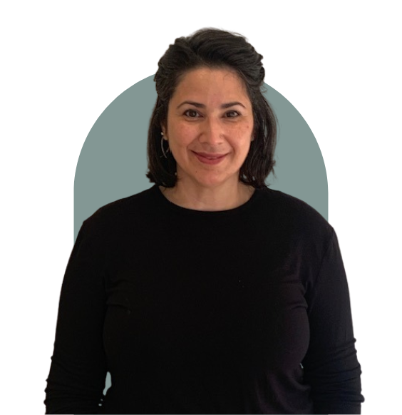 Michelle McMinassian from waist up smiling in a business casual top. 
