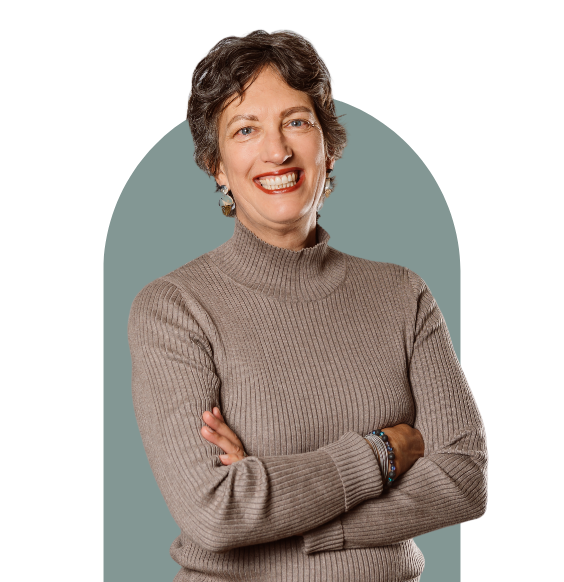 Jane Bowman from the waist up smiling in a black long-sleeve top