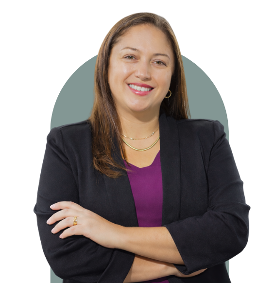 Renata is a member of the Shift Collab team and she's wearing a blazer looking forward and smiling