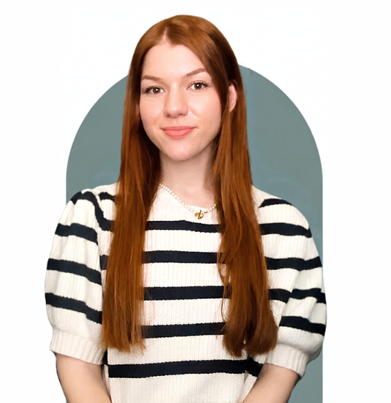 Headshot of Victoria Grimbos from waist up smiling in a business casual top. 