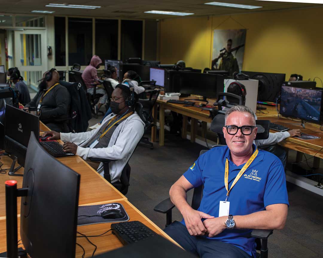 Joel Benton in the Playtropic office with staff.