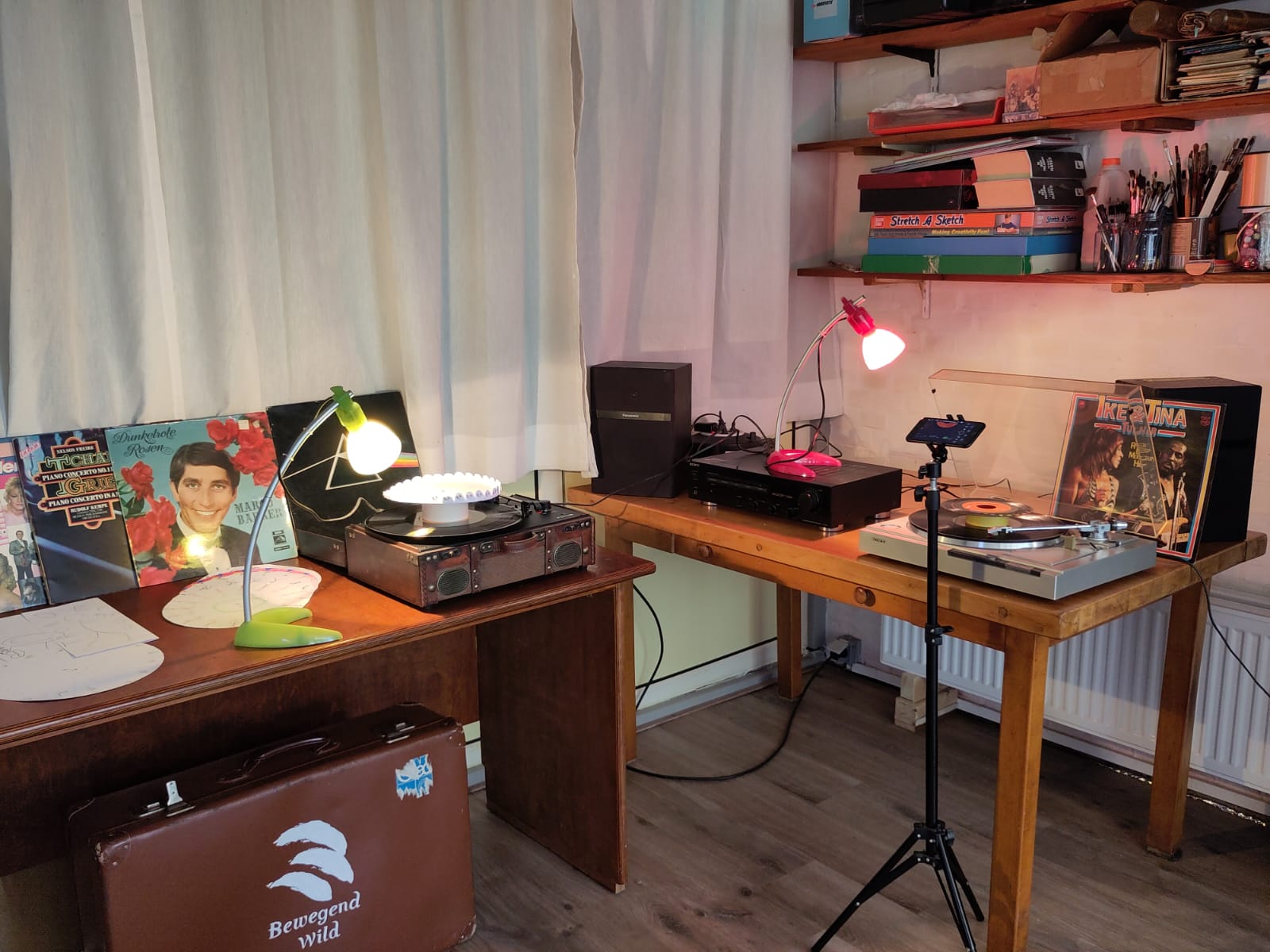 Turntables with phonotrope discs and a camera set up near a window with a Puluz photo light box.