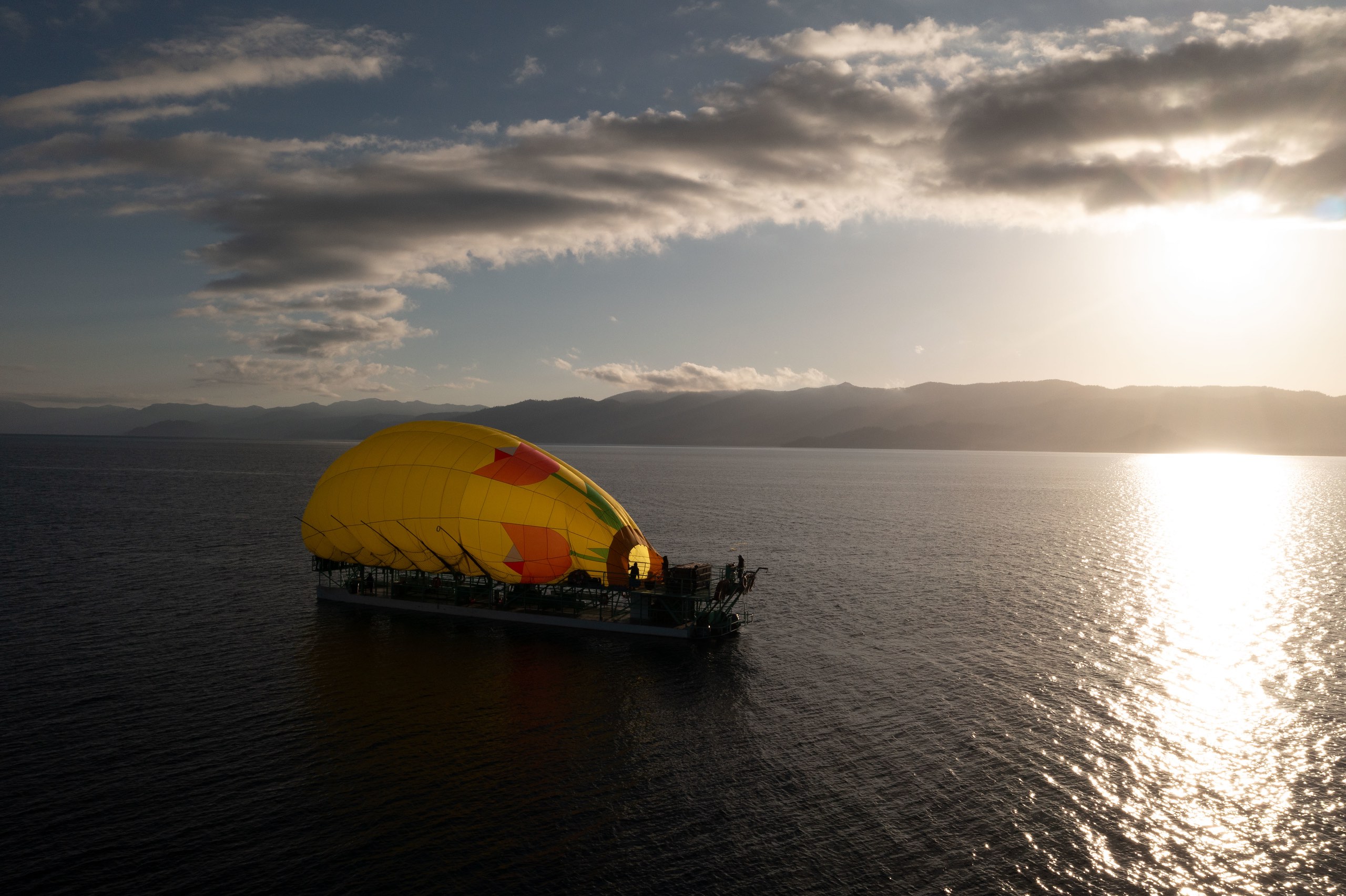 lake tahoe hot air balloon inflating on boat to start hot air balloon ride at dawn