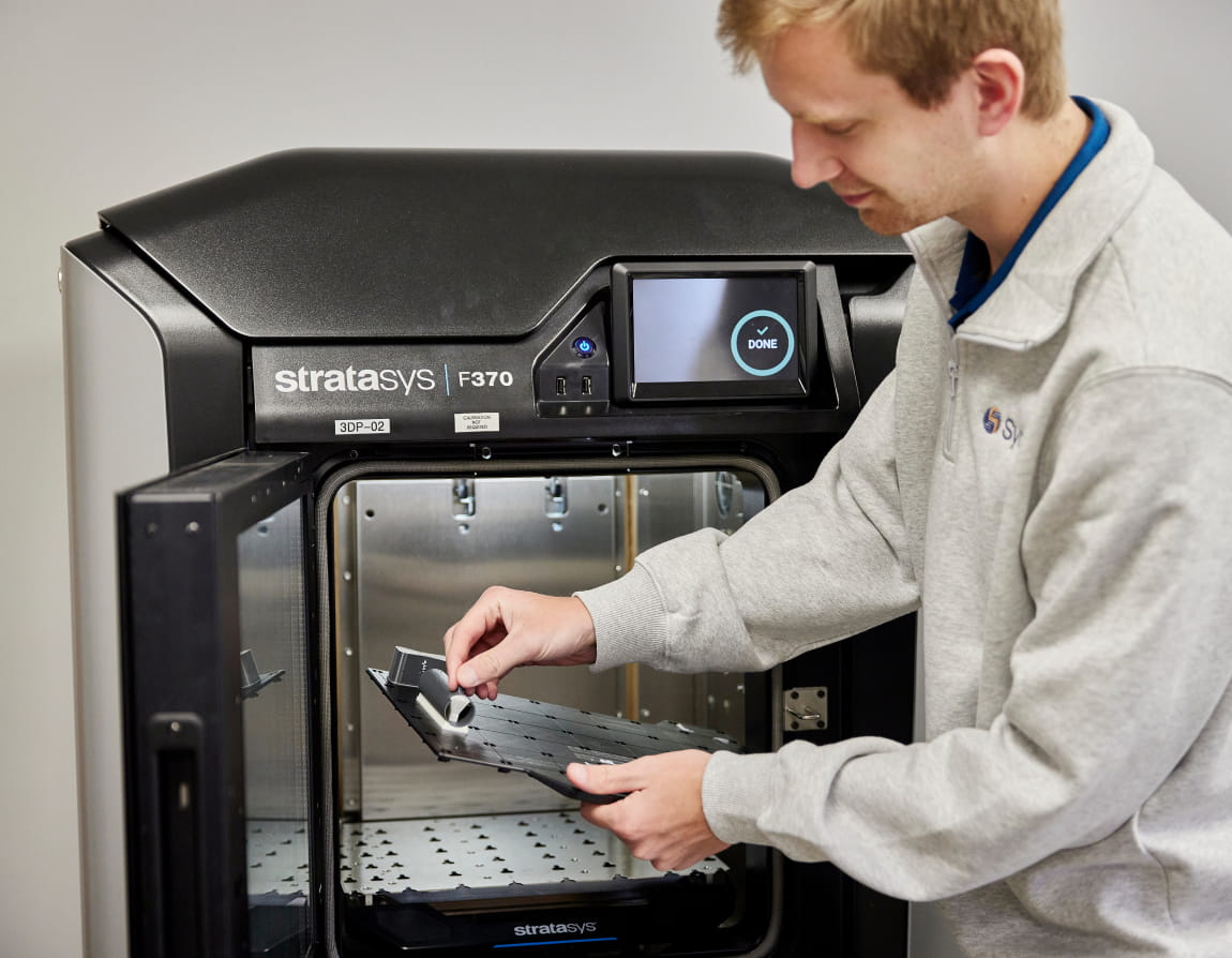 An engineer 3D printing a component
