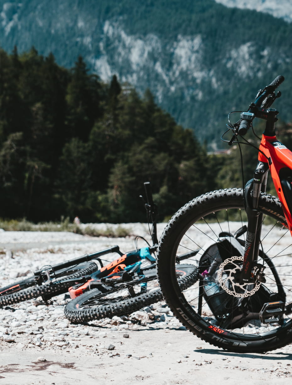 An e-bike in front of a snowy mountain landscape