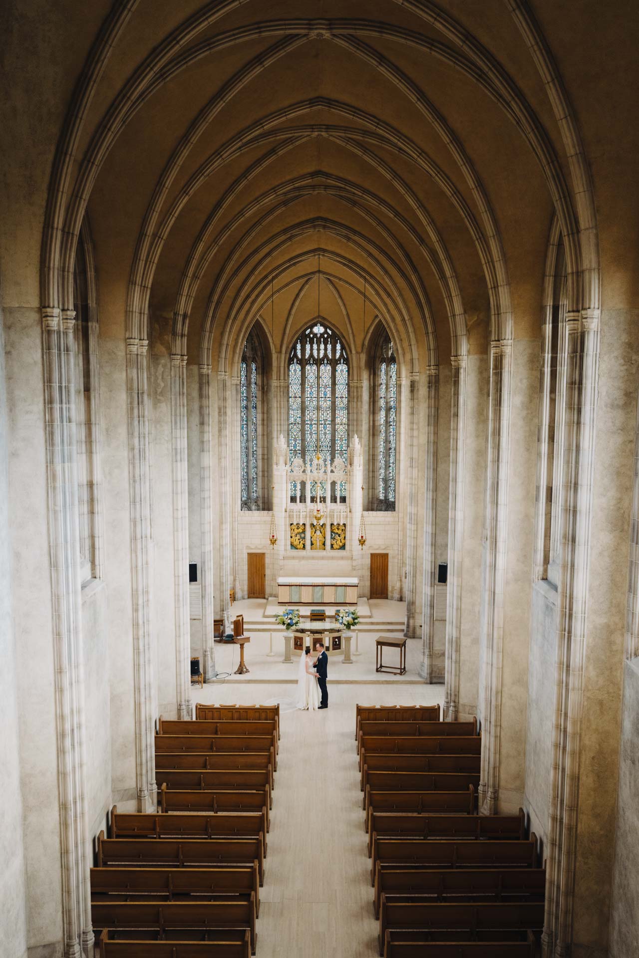 Couple at the altar at Trinity Chapel.