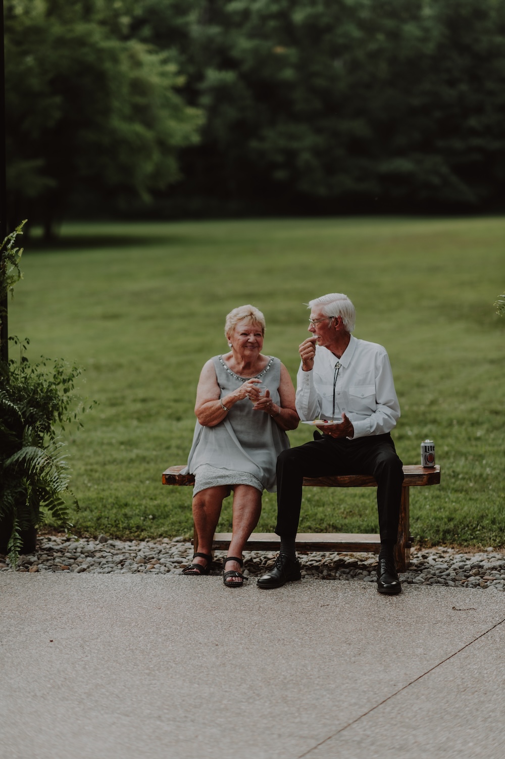 A sweet couple enjoy appetizers and drinks on the patio after the wedding ceremony at this beautiful secluded Kentucky wedding venue.