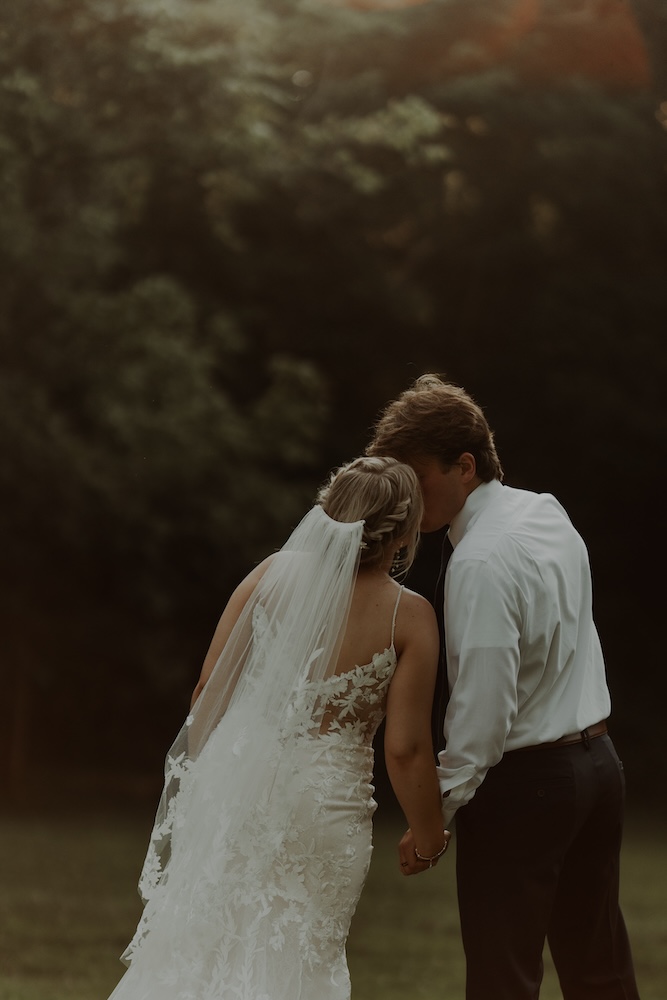 a candid moment for the bride and groom.  Photo captured by Alex Mitro Photography