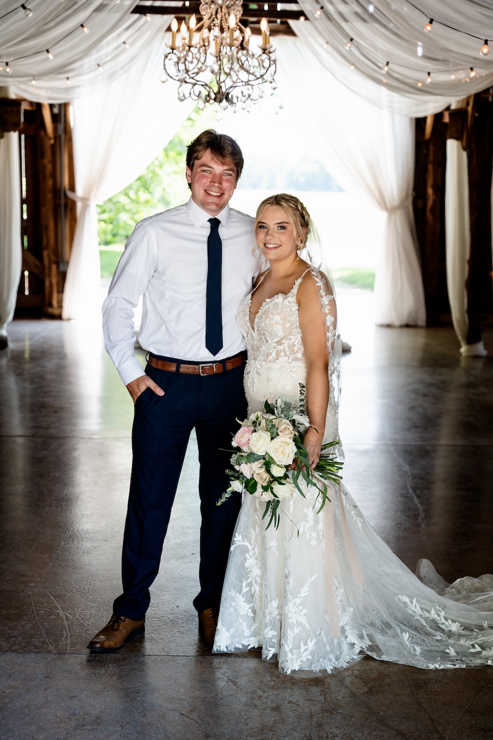 bride & groom portrait standing inside The Barn at Cedar Grove 