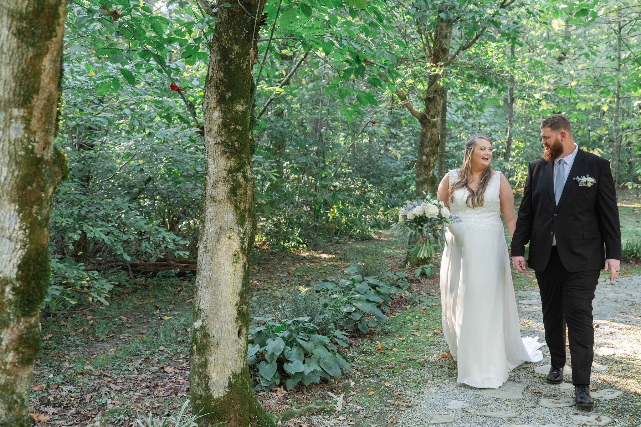 Hannah & Michael exit the woodland ceremony at secluded wedding venue in Kentucky