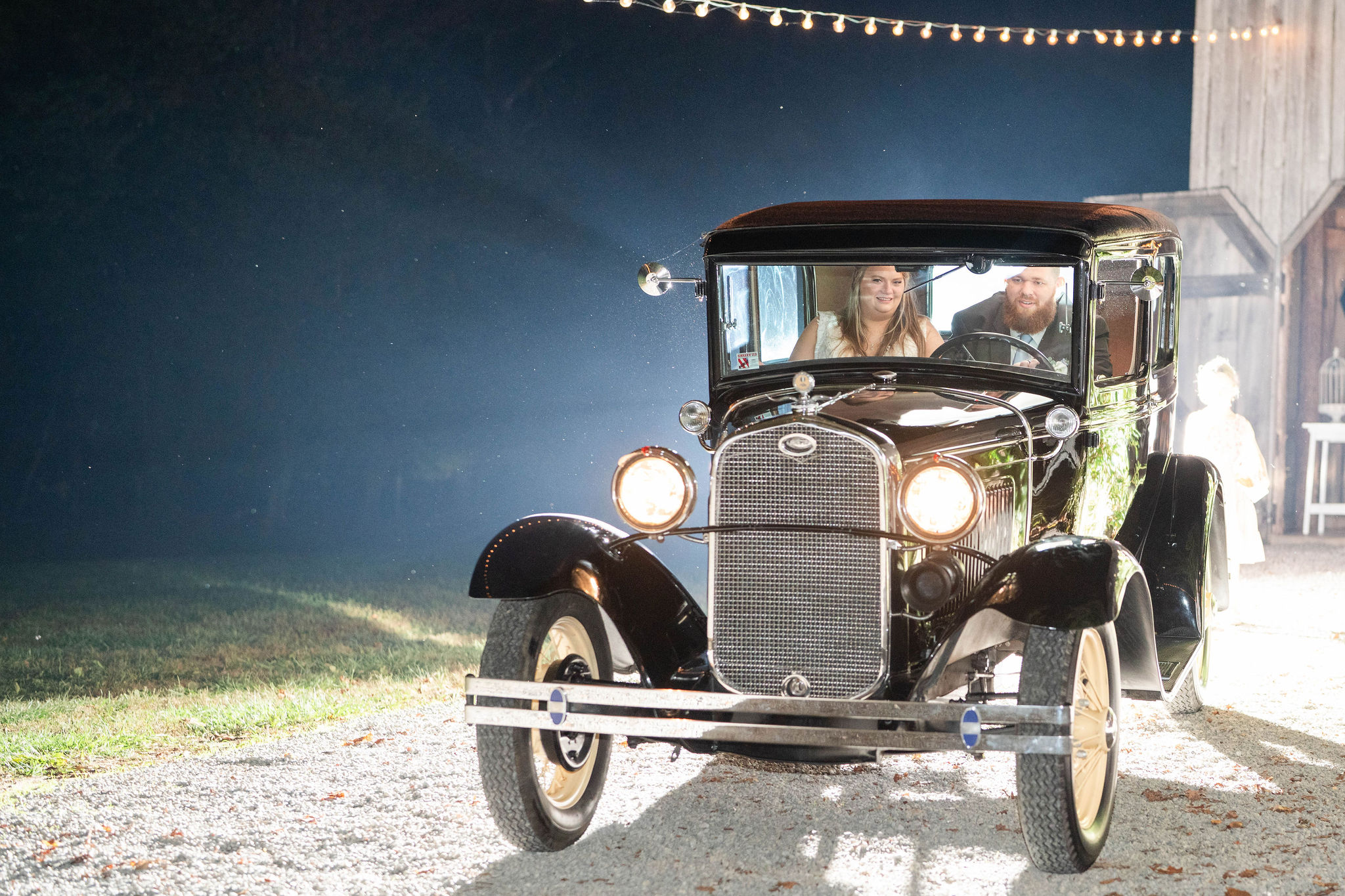 Hannah & Michael in the getaway car at the end of the wedding night at The Barn at Cedar Grove in KY