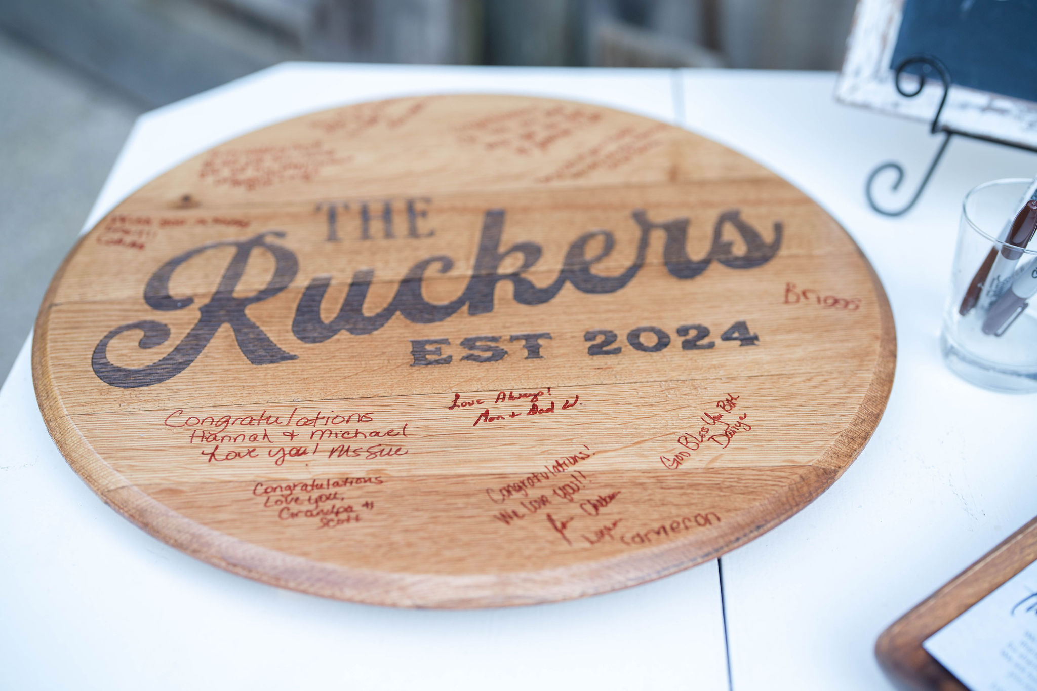 Hannah & Michael chose a personalized barrel head for their guest book.