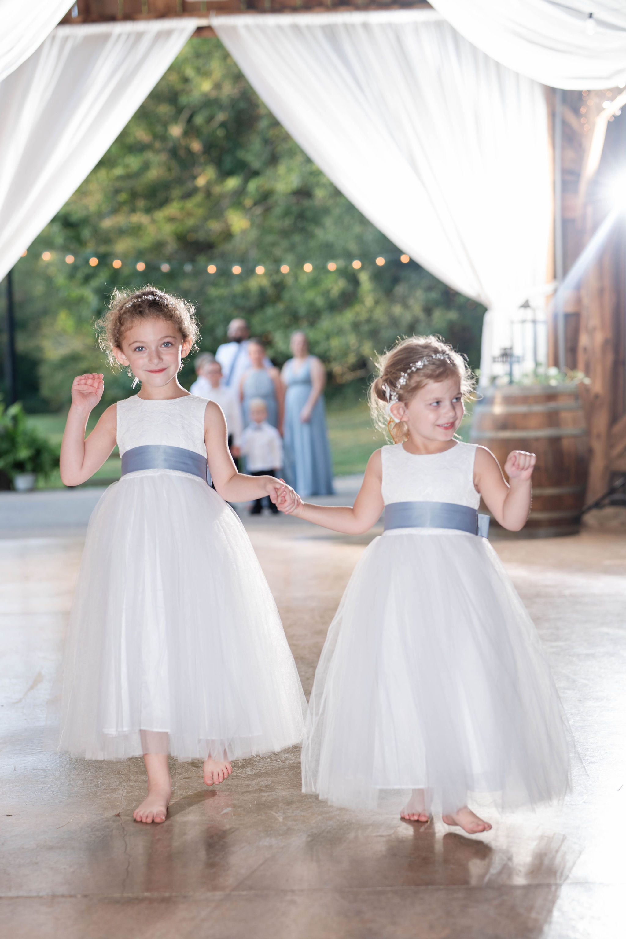 Flower girls enjoy the dance floor.