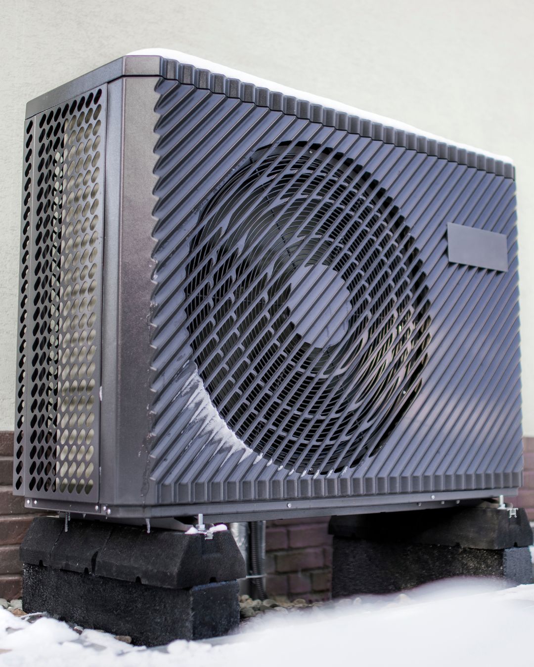 Air source heat pump outside a home