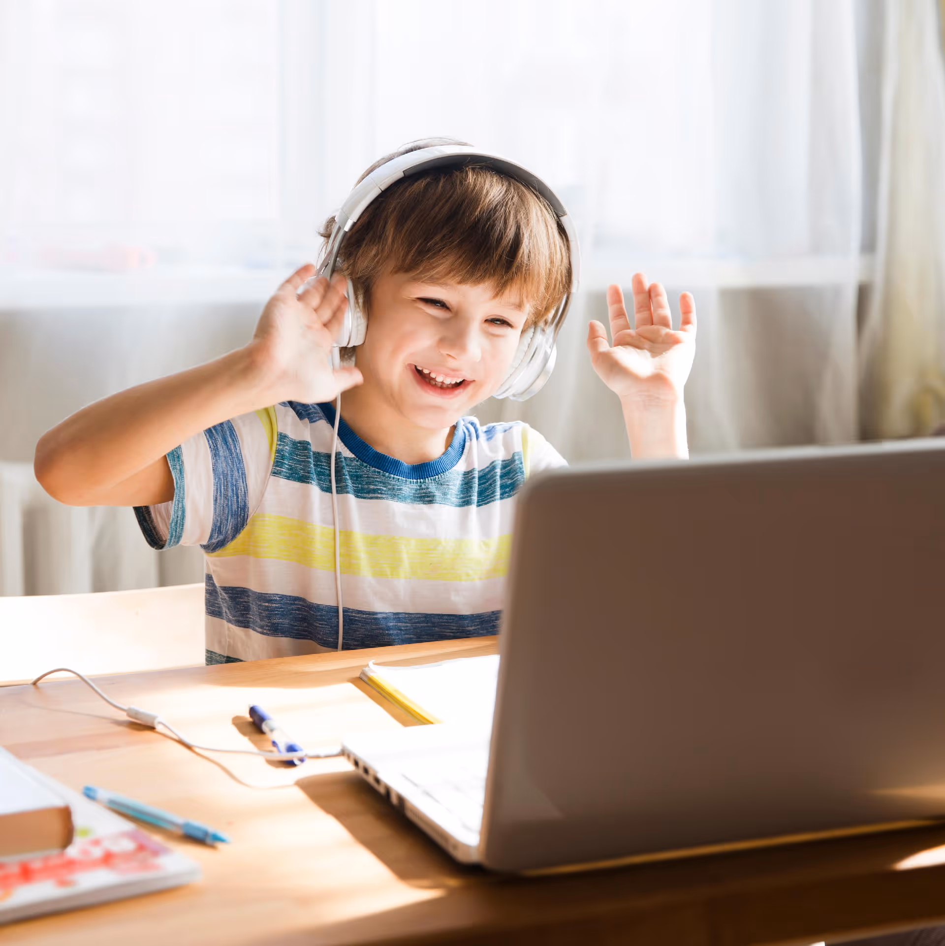 A parent and child engaged together during an online ABA therapy session at home.