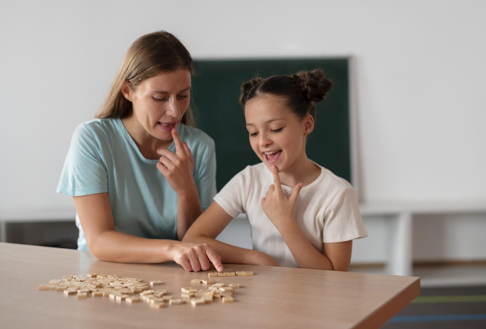 Speech therapist helping a young child with communication