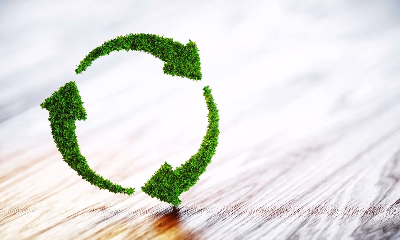 A green recycling graphic superimposed over a wood floor