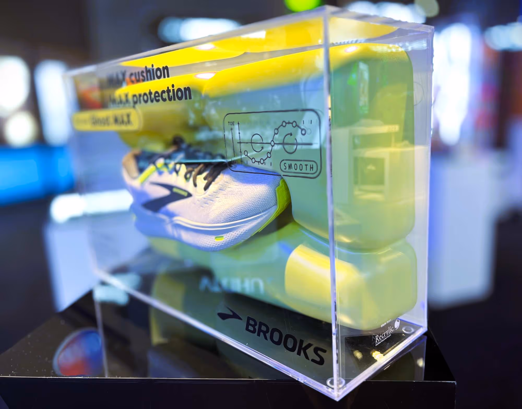 Product fixtures featuring a Brooks running shoe, demonstrating detailed and effective retail display techniques.