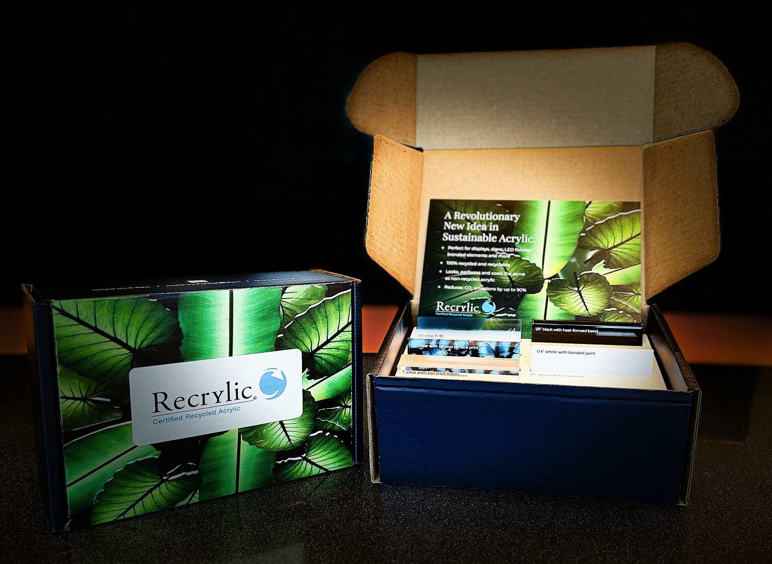 Two Recrylic samples boxes, one closed and one open showing the various recycled acrylic samples inside.