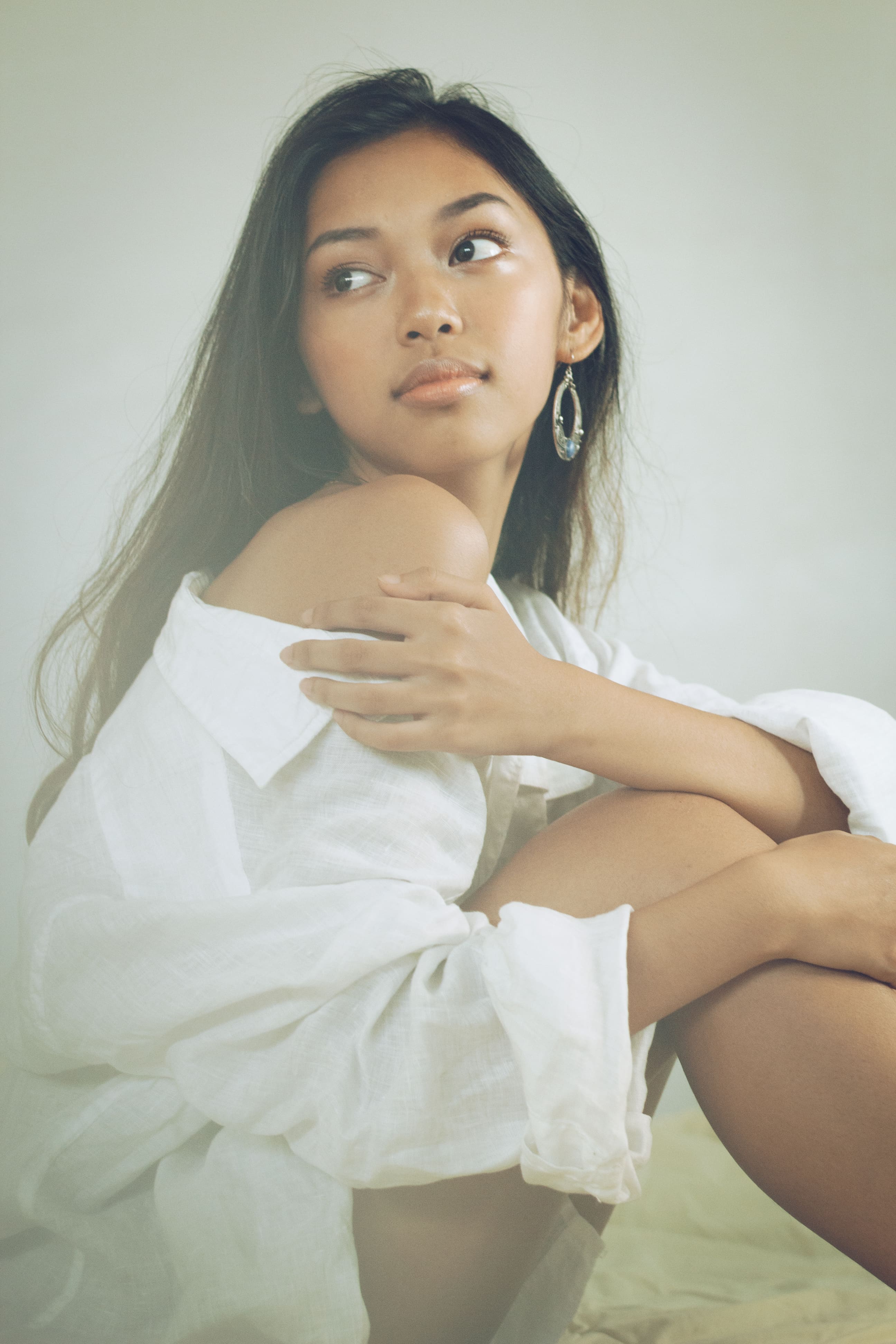 Portrait of a girl in a large white button up