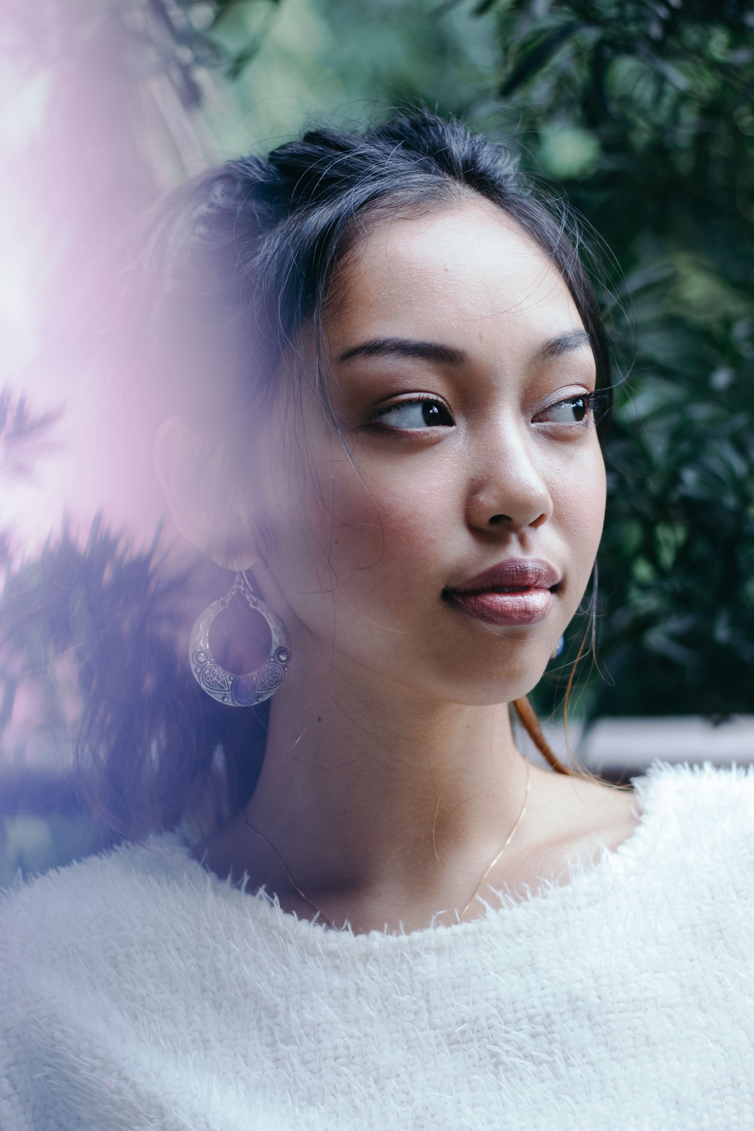Portrait of a girl in white sweater