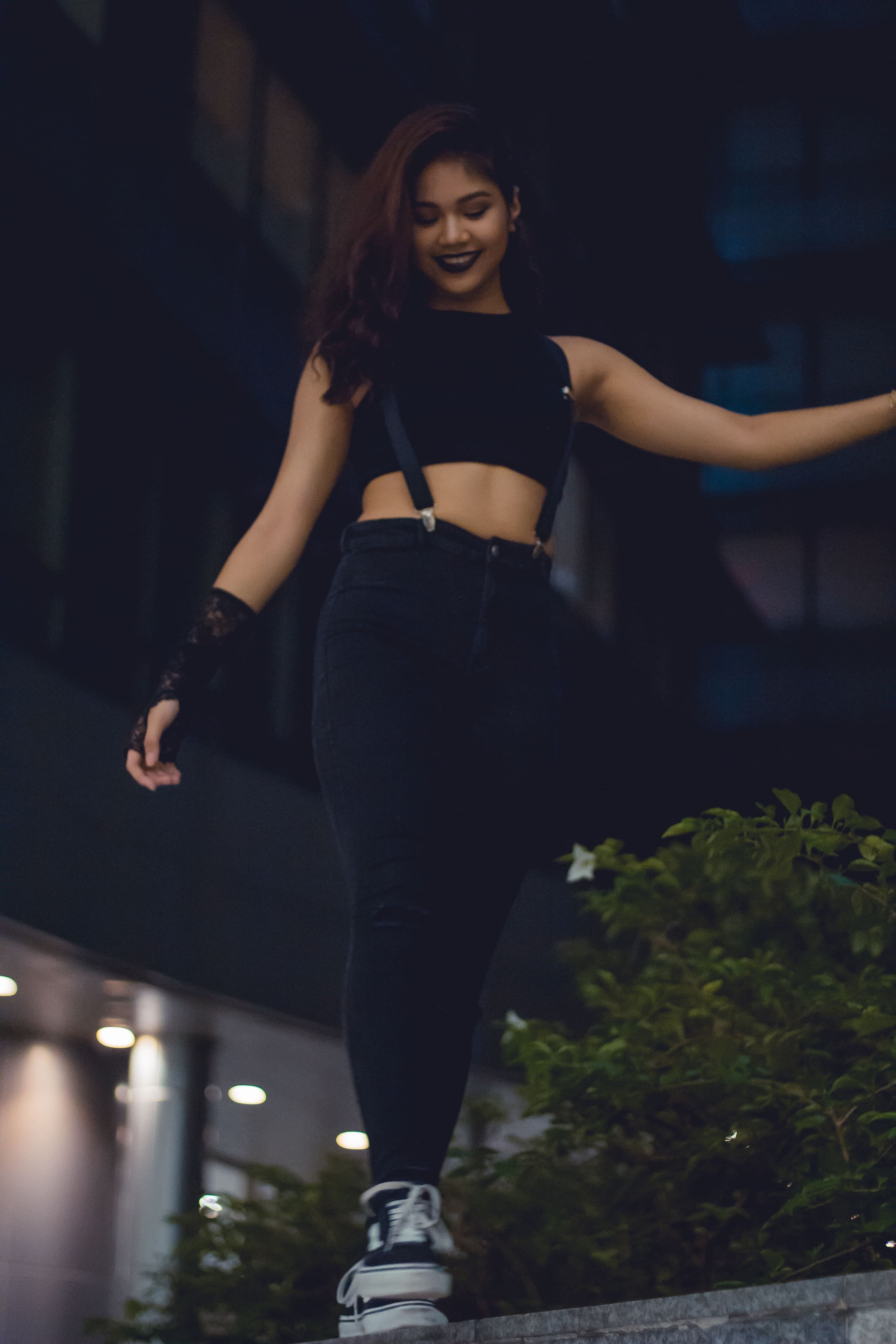 Portrait of a girl walking on a ledge