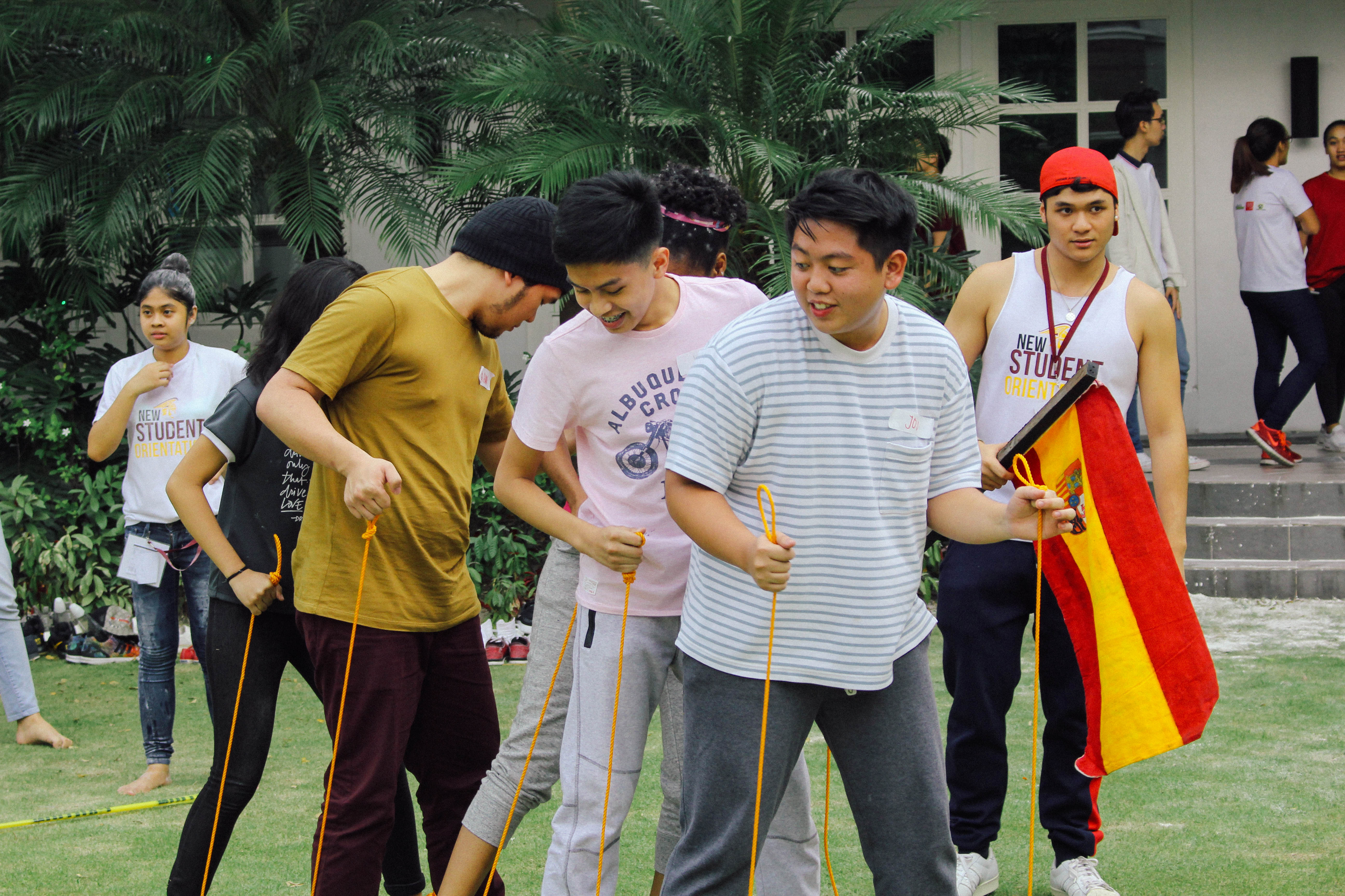 Boys in line with a crowd in the back