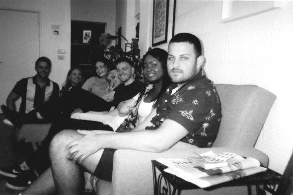 Group on sofa posing and socialising