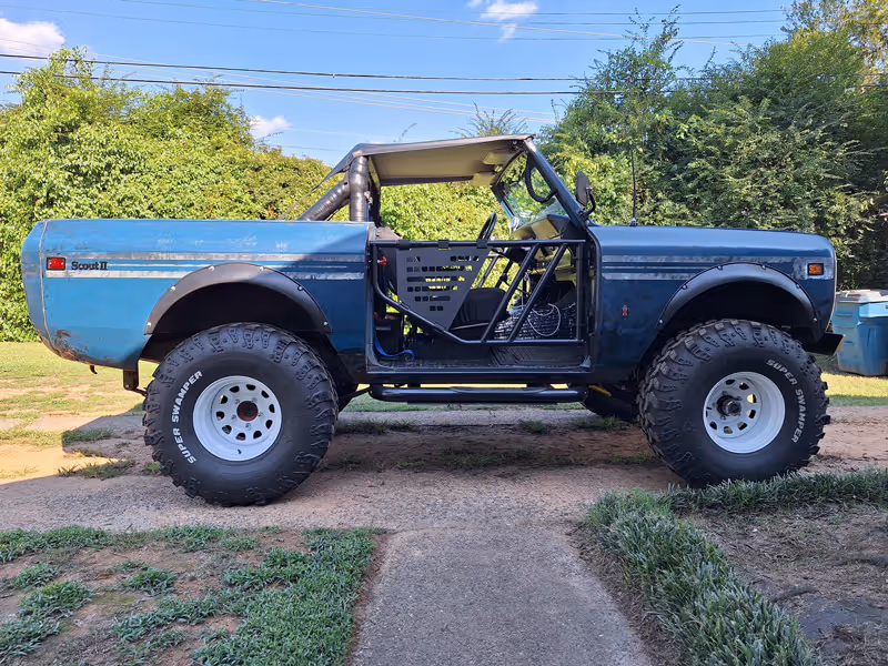 A blue Scout II with Tube Doors by Scout Racks.