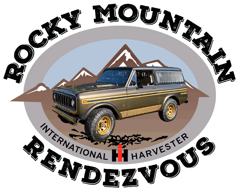 Vintage International Harvester SUV with mountain backdrop and text Rocky Mountain Rendezvous.
