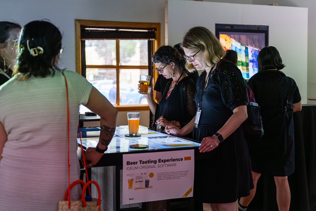 Guests trying out our brand new prototype of the Beer Tasting Experience.