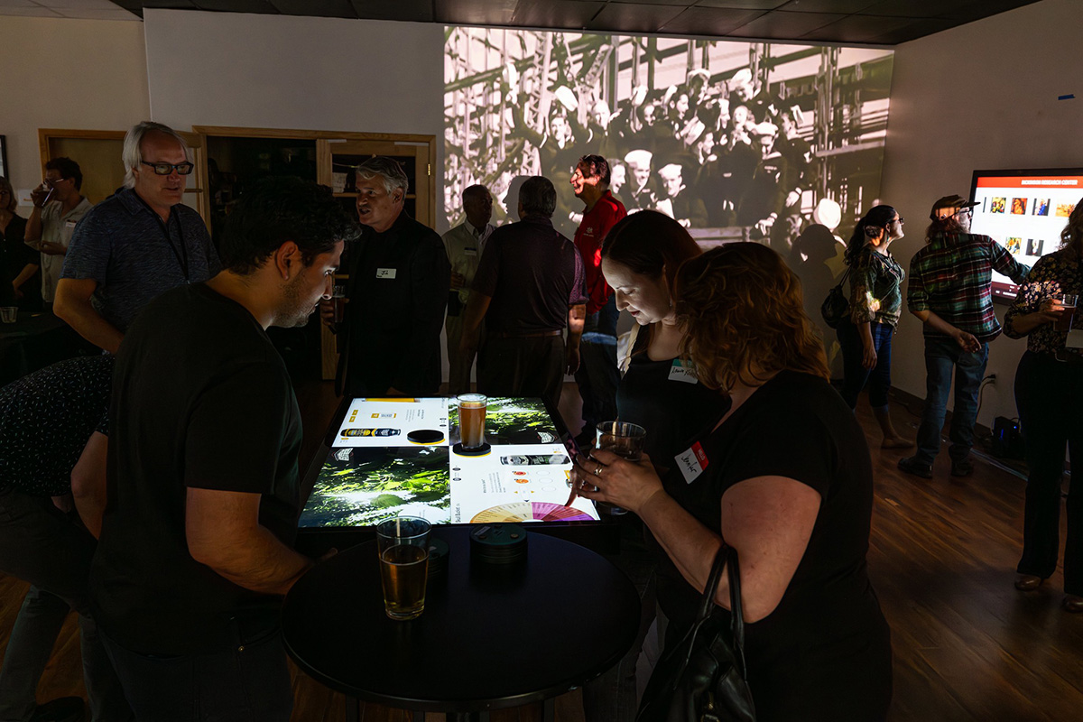 Guests trying out the Beer Experience at our Studio Party