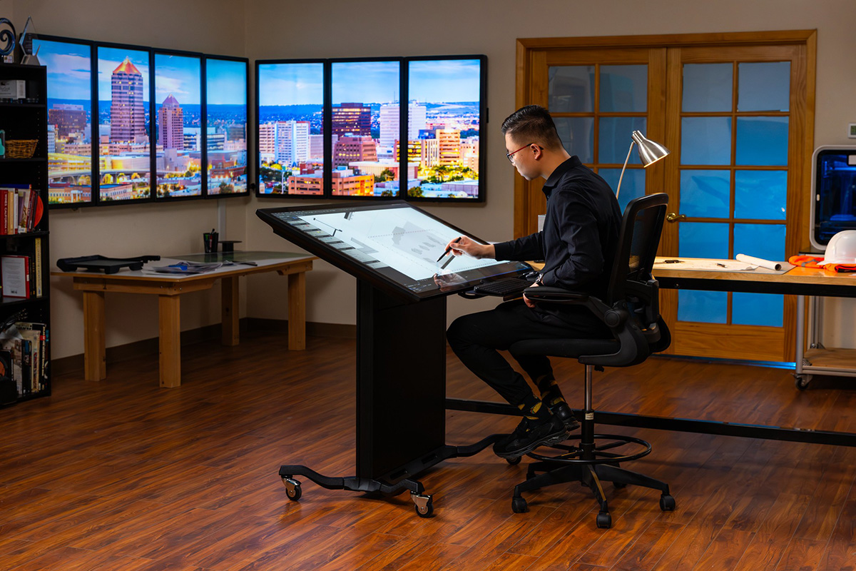 The 55” Optically Bonded Drafting II, pictured here with both a keyboard tray and locking casters, all part of the comprehensive AEC bundle.