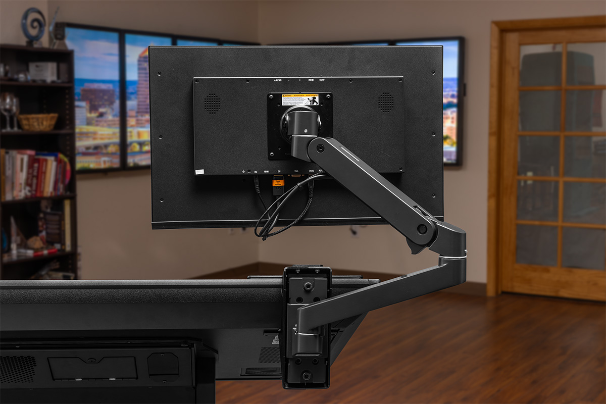 The monitor arm securely mounts to the Drafting II, and includes built-in channels for cable management.