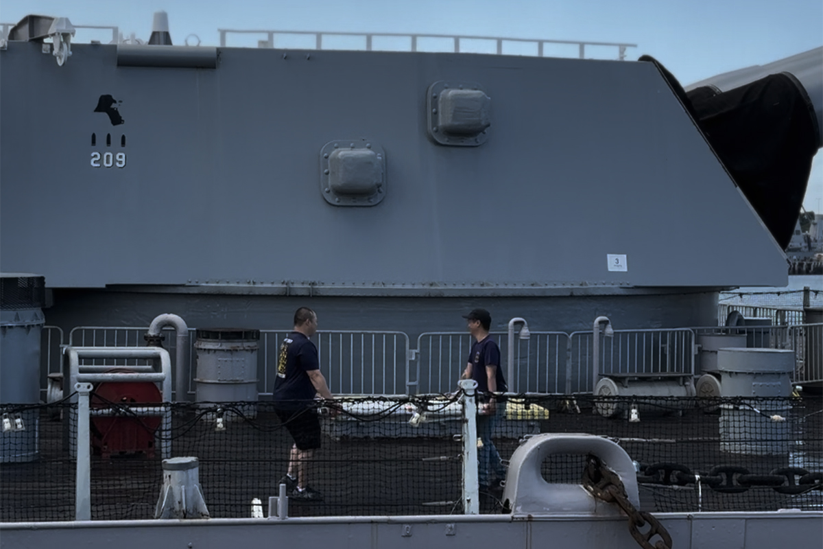 The exhibit components being carried onto the USS Missouri