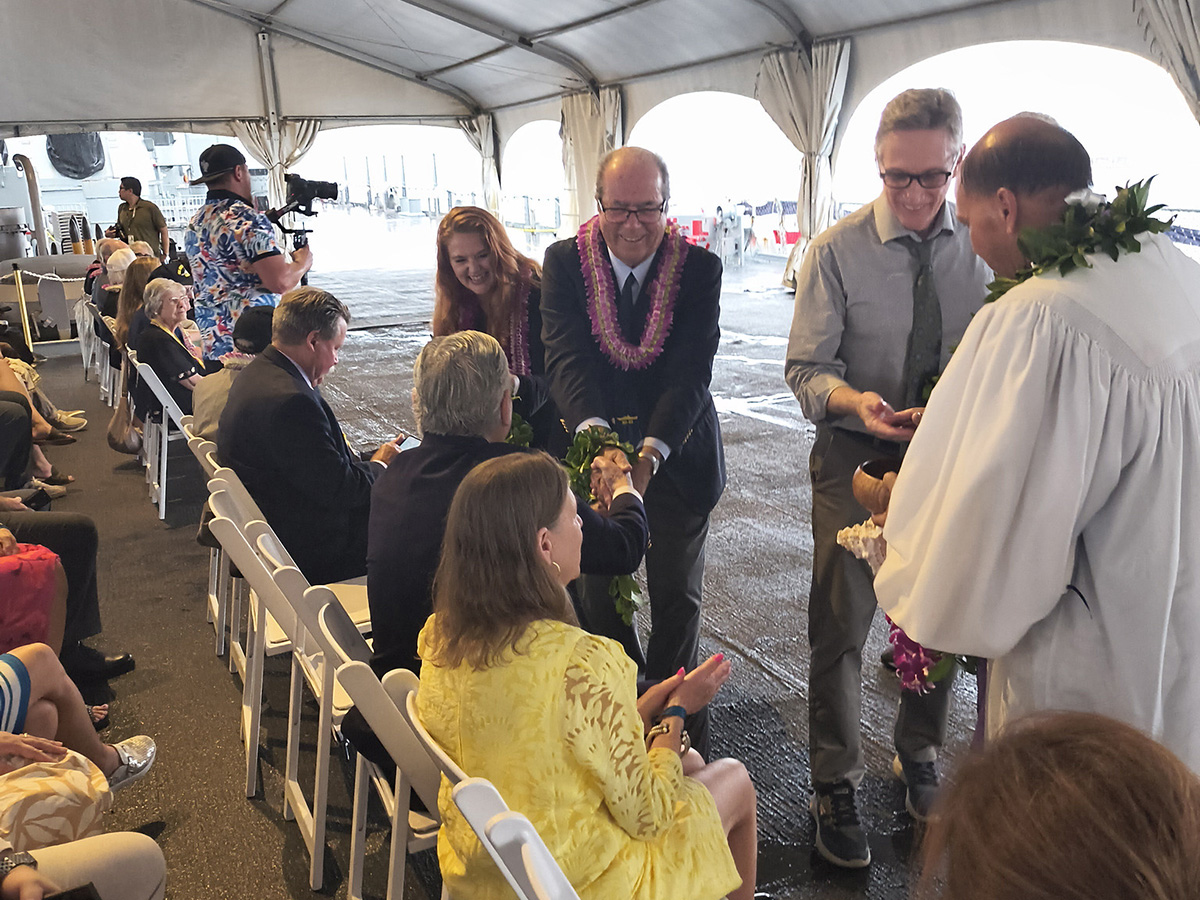 USS Missouri Memorial Association President Michael Carr (center), along with Clifton Truman Daniel (right), grandson of President Harry Truman, participates in the blessing for the eight veterans and the exhibit opening.