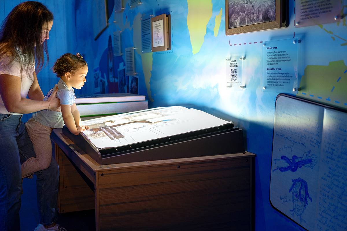 Visitors interacting with the Enchanted Book at the Mote Science Education Aquarium.