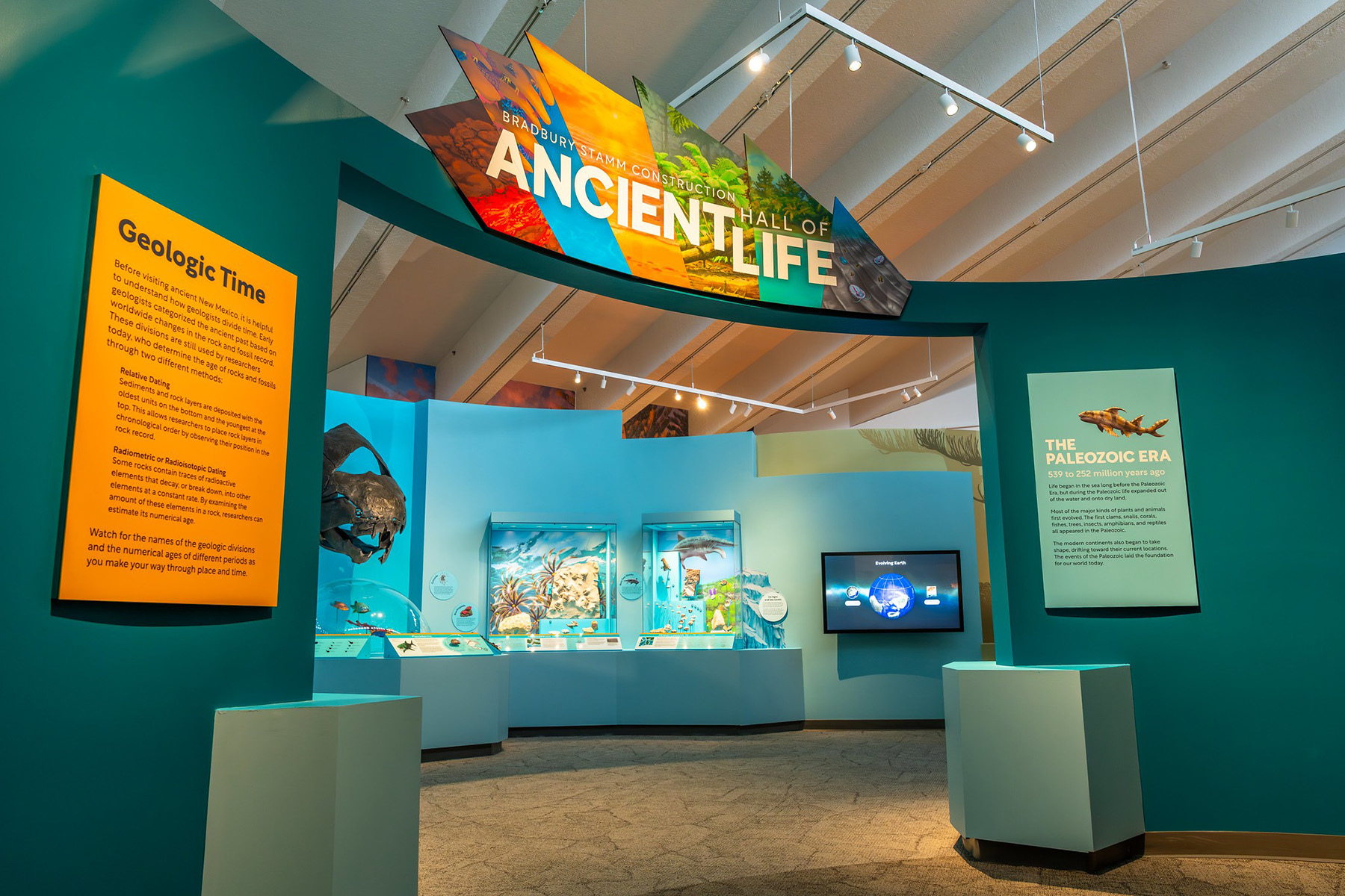The entrance to the Hall of Ancient Life exhibit opens with fossils and Ideum’s Exploring Earth interactive.