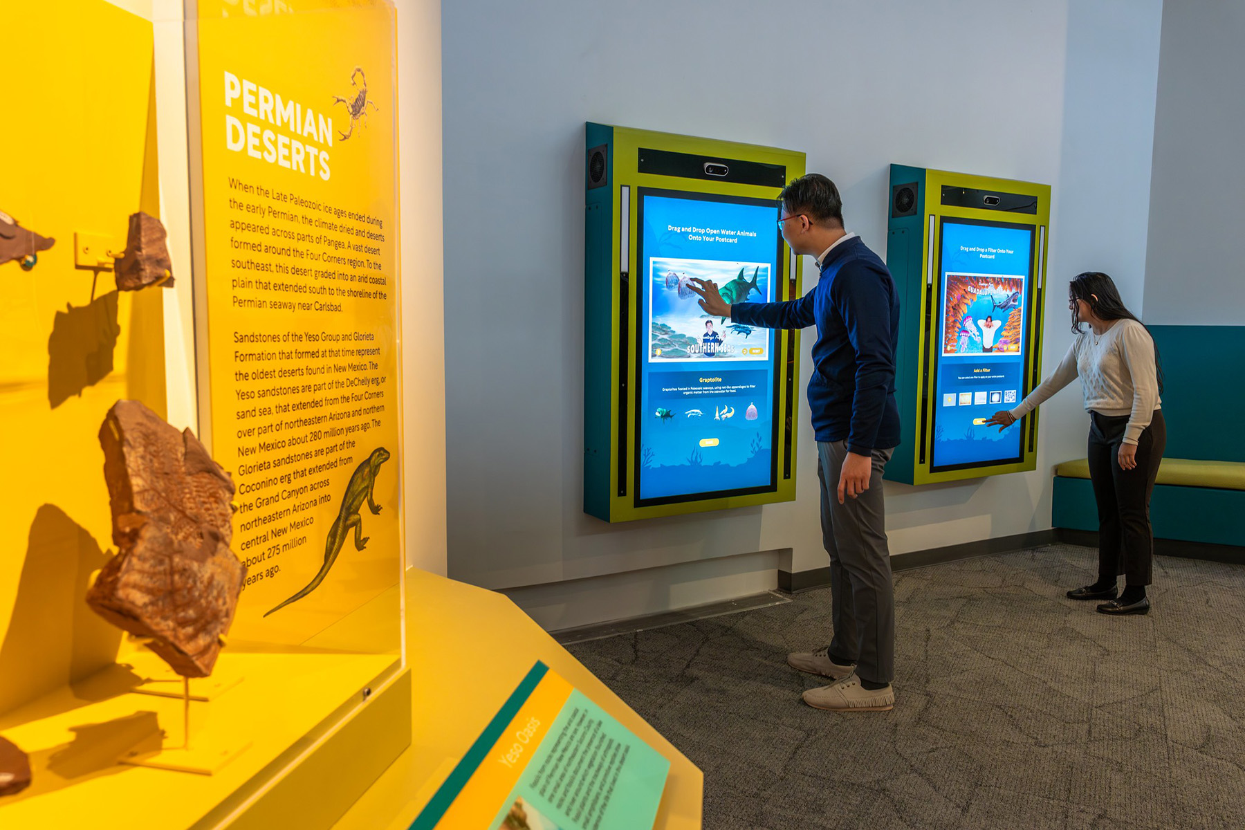Postcards from the Paleozoic can be found further in, with two custom wall fixtures painted to match the exhibits jewel toned color palette.