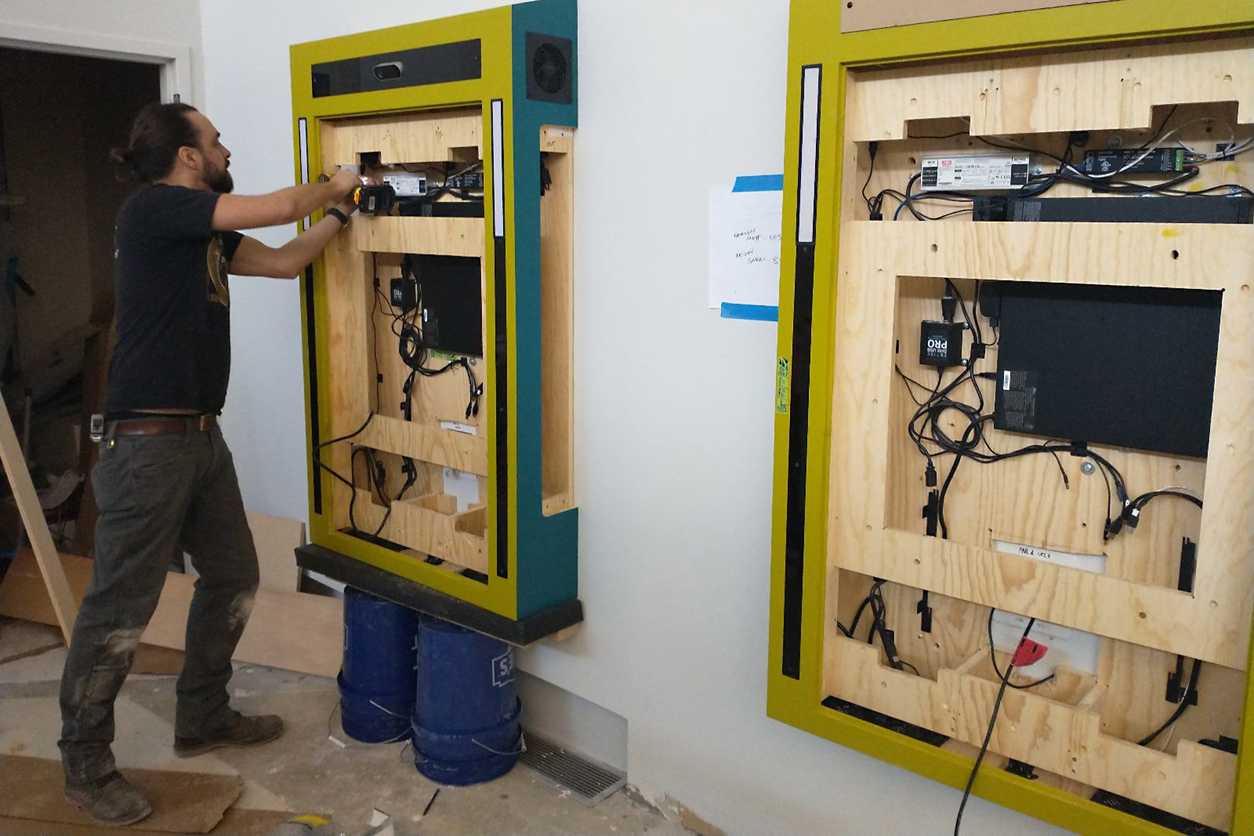 A behind the scenes peek shows our fabrication team installing the cabinets, where you can see all the inner workings of each interactive exhibit.